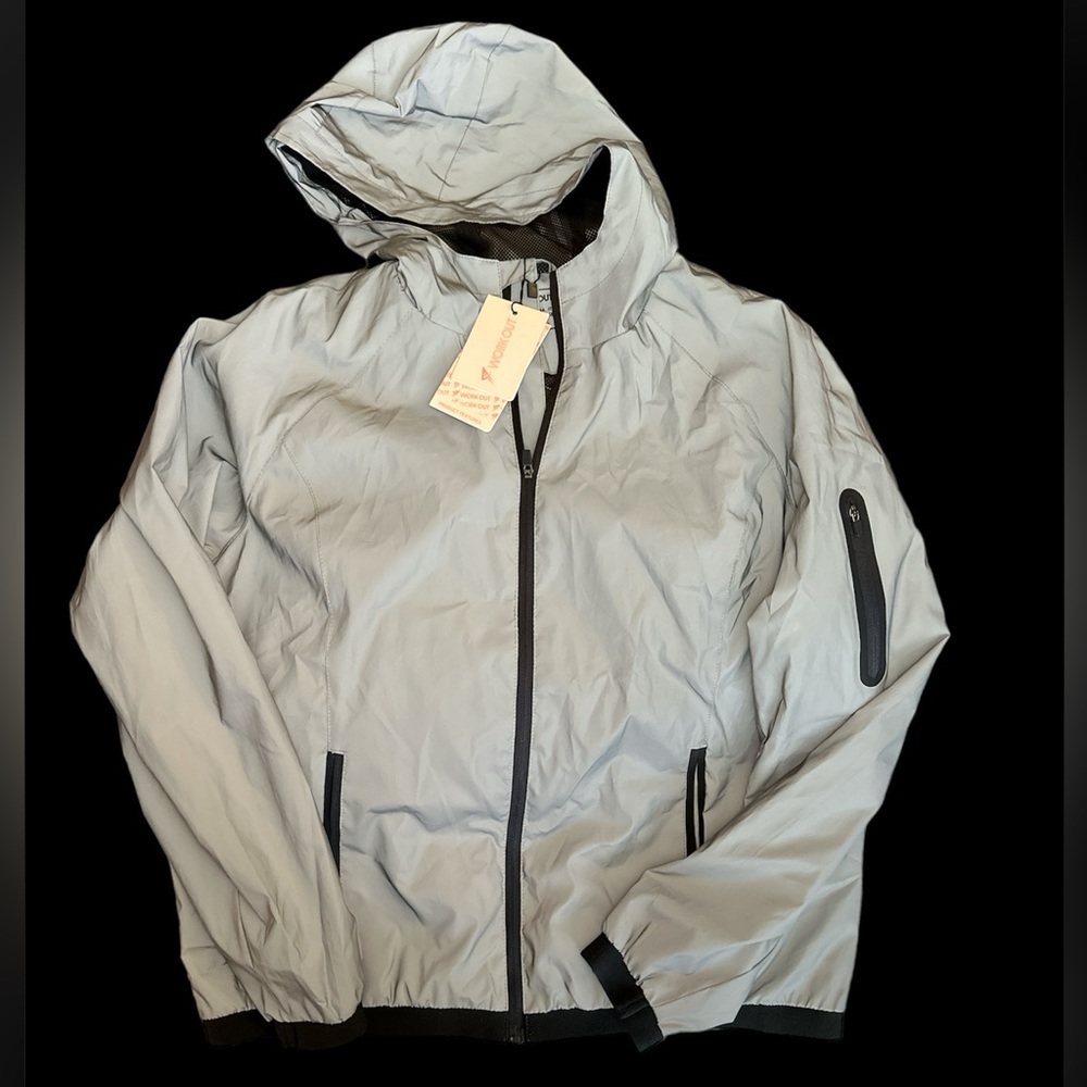 Reflective workout jack. NWT. Sz 12. Lots of pockets